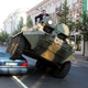 Illustration for article titled Mayor crushes misparked luxury car with troop carrier